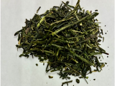 Close-up of dry green tea leaves.