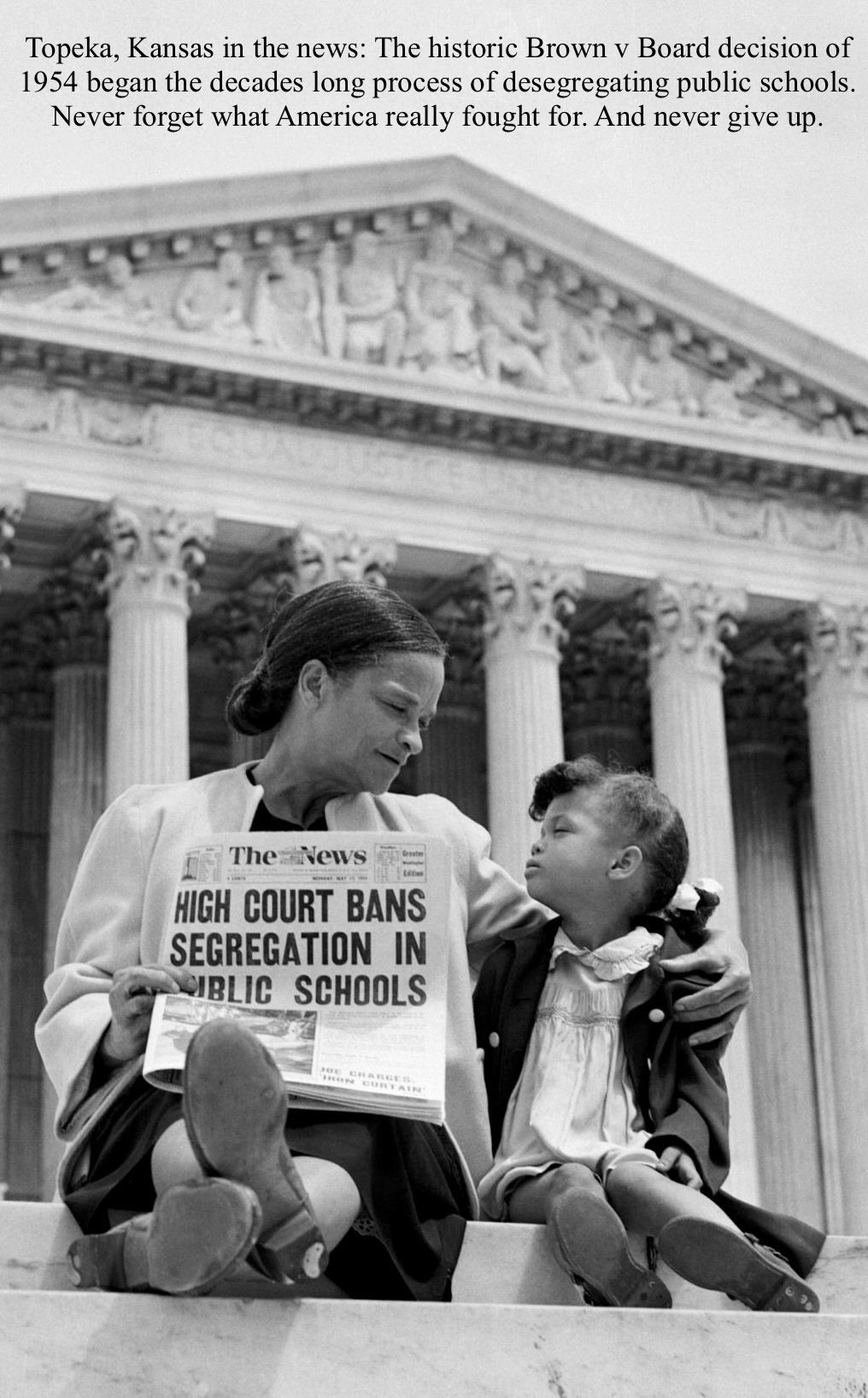 A woman and child celebrate the Supreme Court's ban on school segregation.