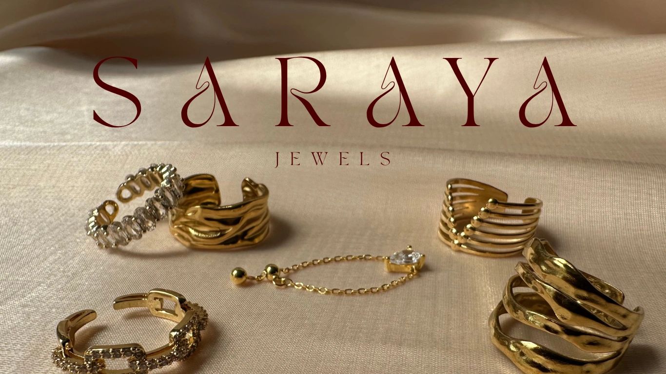 Stack of books next to pencils in a holder and a camera.