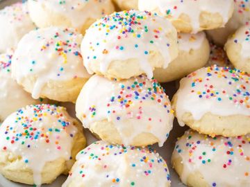 Frosted cookies with colorful sprinkles.