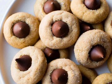 Sugar cookies topped with chocolate kisses.