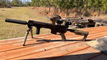 AR57 5.7x28mm rifle with a Banish 30 Gold suppressor and tan furniture. Most recent build.