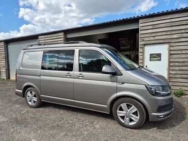 VW T6 with Skyline pop top closed, outside the Sharkbite workshop