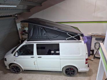 VW T5.1 with its old pop top replaced by a new Skyline roof