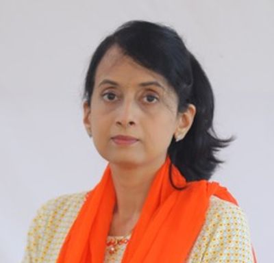 Portrait of a woman in traditional attire with an orange scarf.