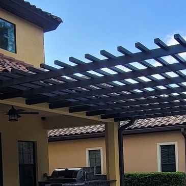 Aluminum pergola that is attached to the house