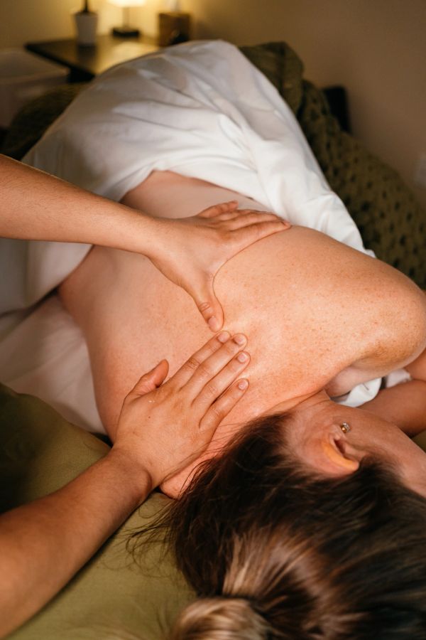 Person receiving a back massage.