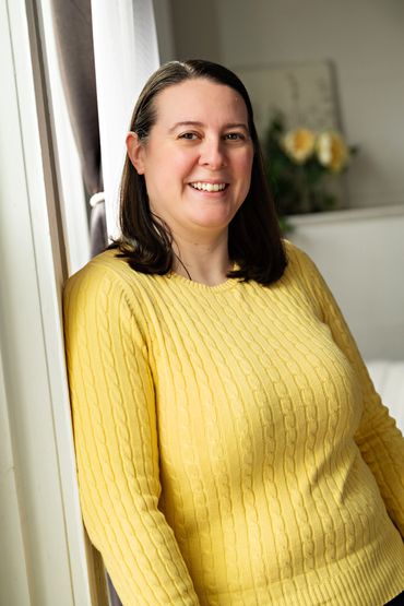 Business professional posing for camera in natural setting