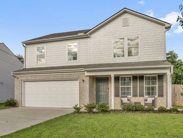 Modern two-story house with a two-car garage.