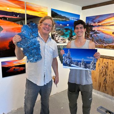 Owner and customer with art and metal print
