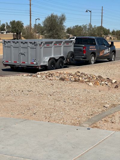 Junk removal set up pulling dump trailer