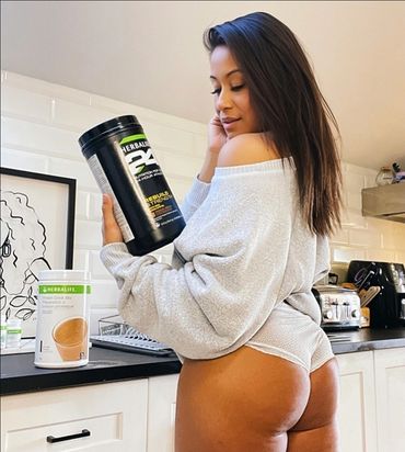 Young indigenous woman wearing hoody and underwear pre workout before filming episode of auntiez