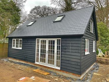Grey timber framed building