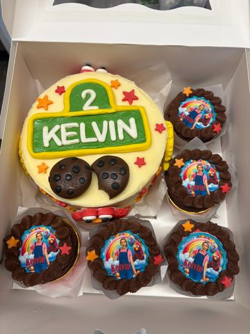 Colorful birthday cake and cupcakes for Kelvin's 2nd birthday.
