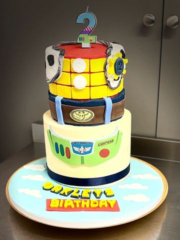 A Toy Story-themed birthday cake for a 2-year-old named Oakley.