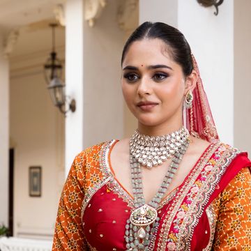 A woman in traditional Indian attire with beautiful jewelry.