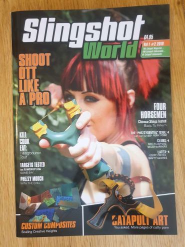 Magazine cover featuring a woman with a slingshot, titled Slingshot World.
