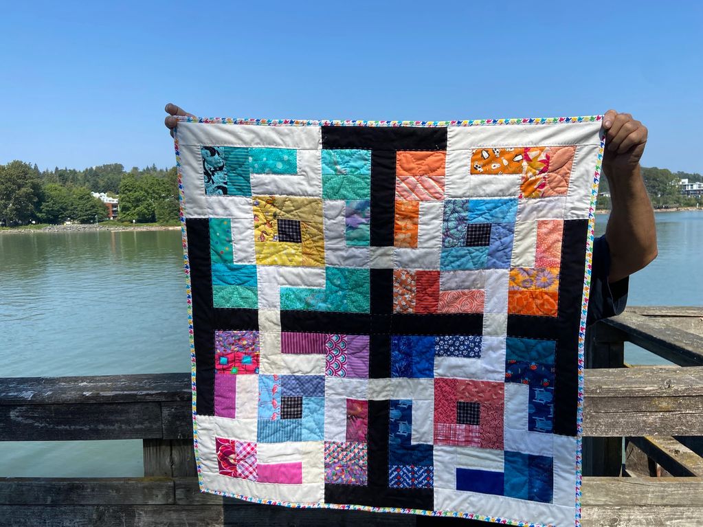 Episode 55 "Square Dance" potato chip quilt, very easy and scrappy using a common background fabric.