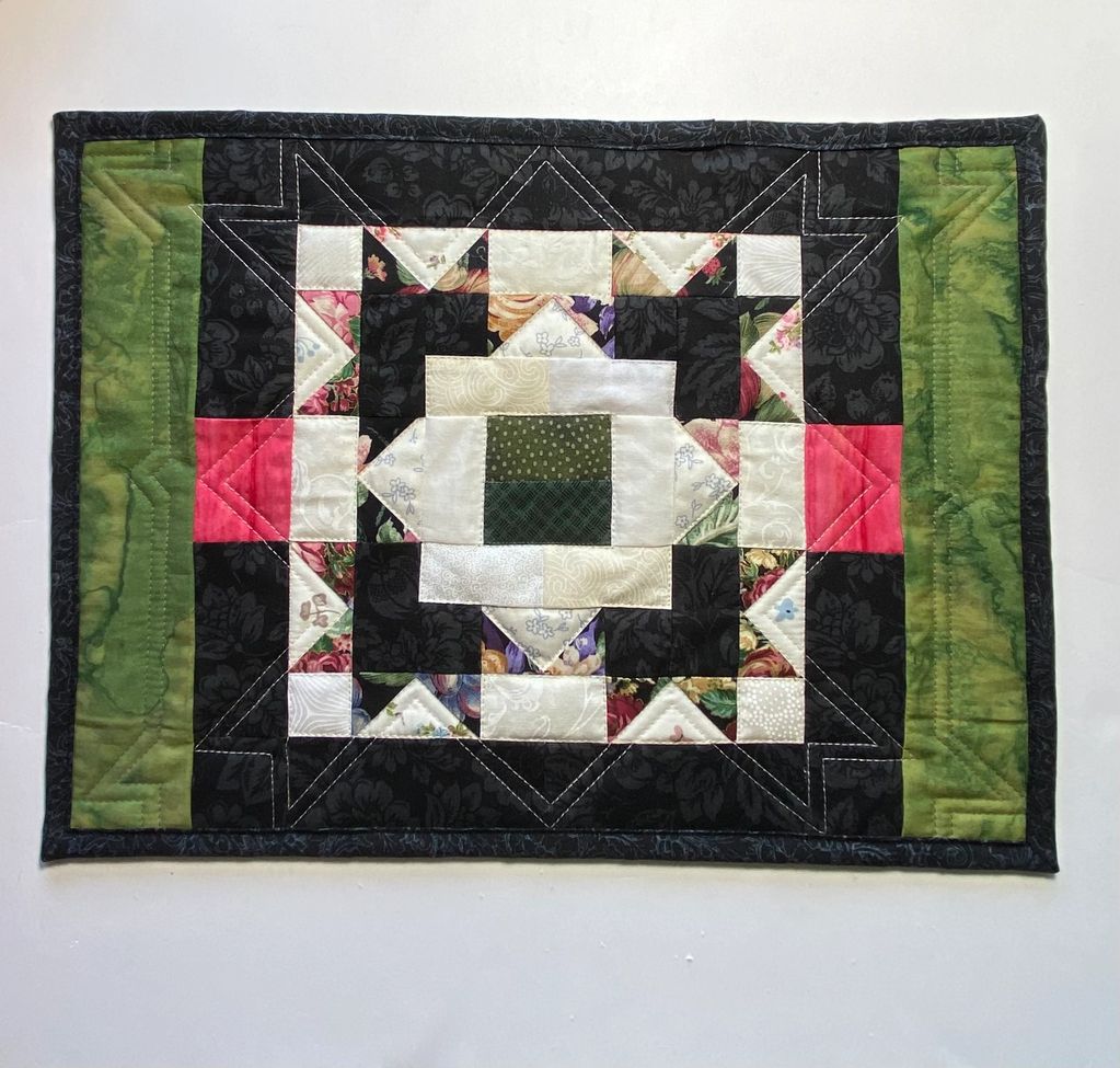 Featured block from Scrap Happy, finished into a placemat by adding borders, binding.