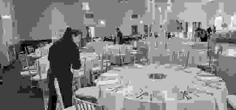 Orlando Party Servers event staff preparing tables for a wedding reception in Central Florida