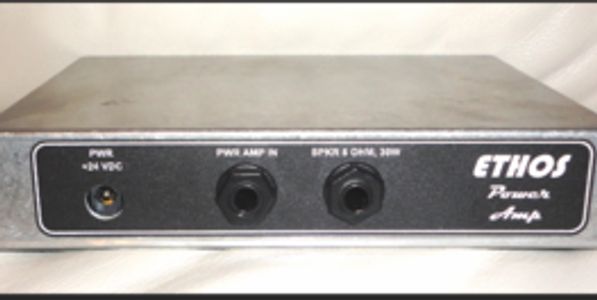 A vintage Ethos preamp amplifier with a metal casing.