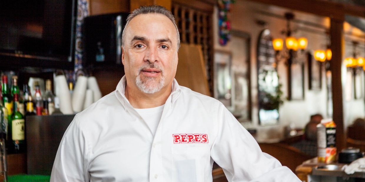 A Man With a Beard in a White Shirt