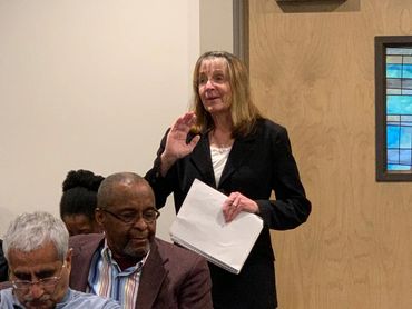 HCCC Board member Judy Smith asks question