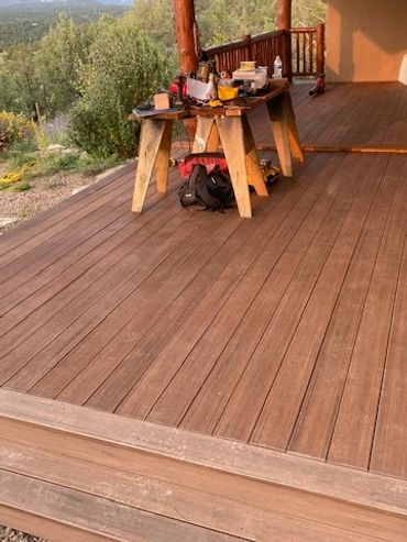 Custom deck designed to match house with custom timber framing