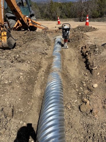 culvert replacement road rebuilding excavation compaction rebuilt road