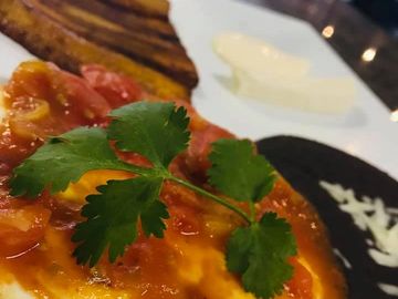 Huevos Rancheros 
Plantains, crema, queso fresco, beans & hot, fresh tortillas made when you order!