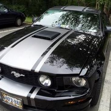 Black Mustang with white vinyl/decal