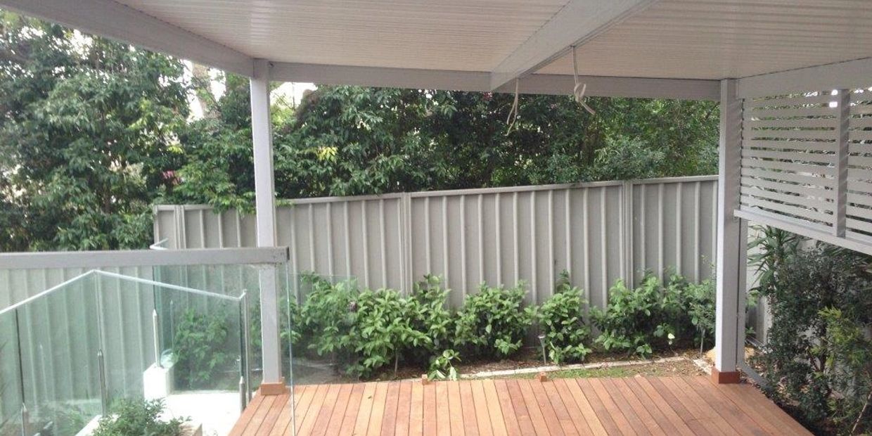 Outdoor timber deck with Colorbond metal awning and louvred privacy sceen
