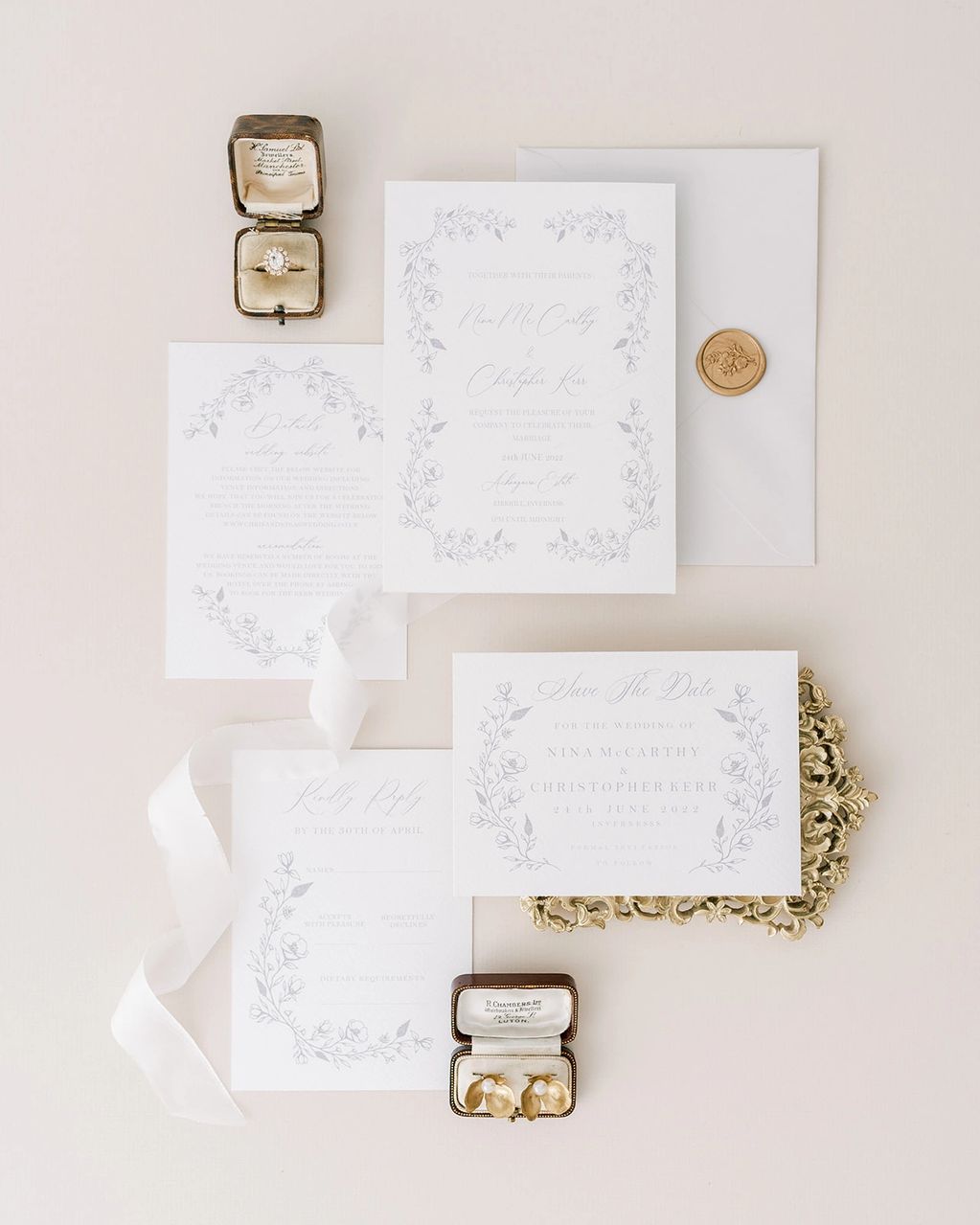 hand-drawn floral wedding invitation with engagement ring, ribbon and wax seal