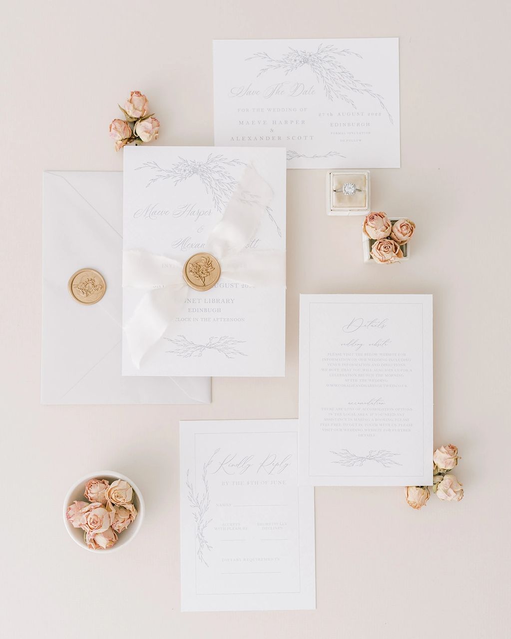 botanical illustrated wedding invitations with silk ribbon and wax seals styled with rose buds