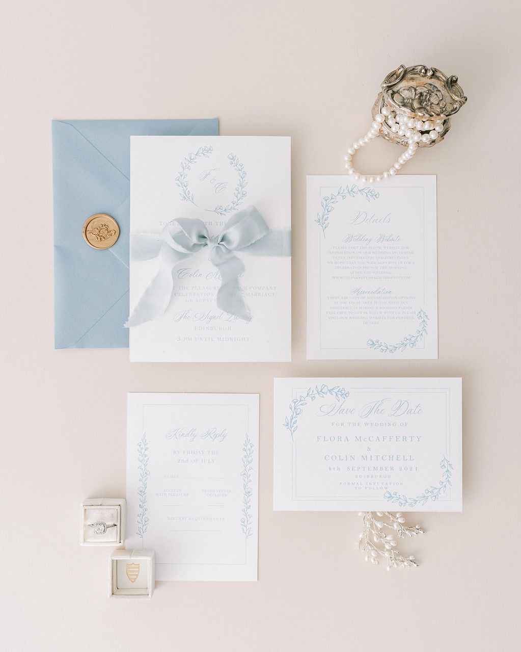 blue floral monogram invitation with silk ribbon and wax seal