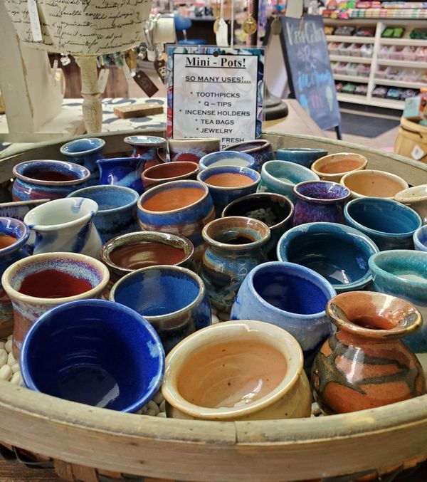 Image: gifts for sale show assorted mini ceramic pots