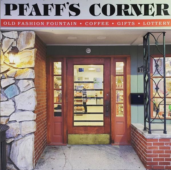Image: storefront Pfaff's Corner old fashion fountain, coffee, gifts and lottery sign