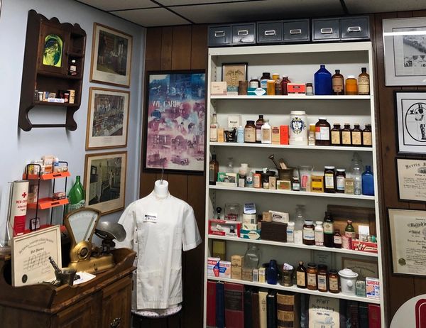 Image: museum-type setting of the history of Pfaff's Pharmacy paying tribute to Dwayne Bloemers