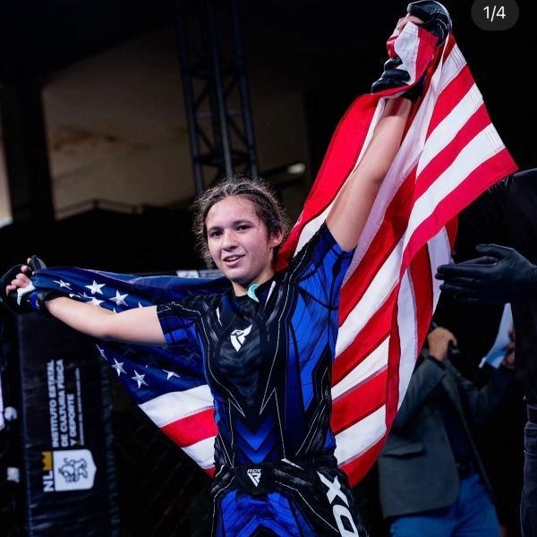 MMA fighter celebrating with American flag.