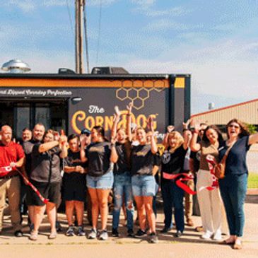 ribbon cutting photo for the corndog cook food truck