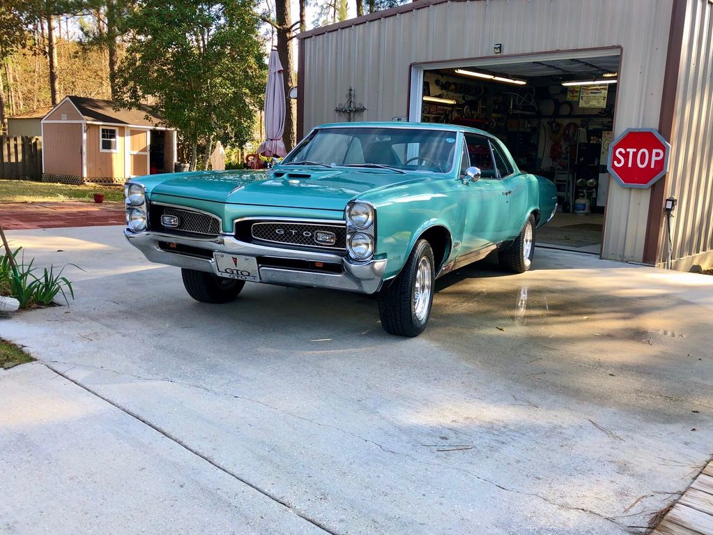 1967 Pontiac GTO.
Color:           Gulf Turquoise, Original GM Color.
Interior:       Turquoise
Moto
