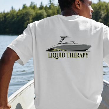 Man wearing a white "Liquid Therapy" t-shirt with a boat graphic on the back.