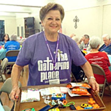 Lorenda Baldwin shows some of the items used during a Gathering' activity to promote brain health