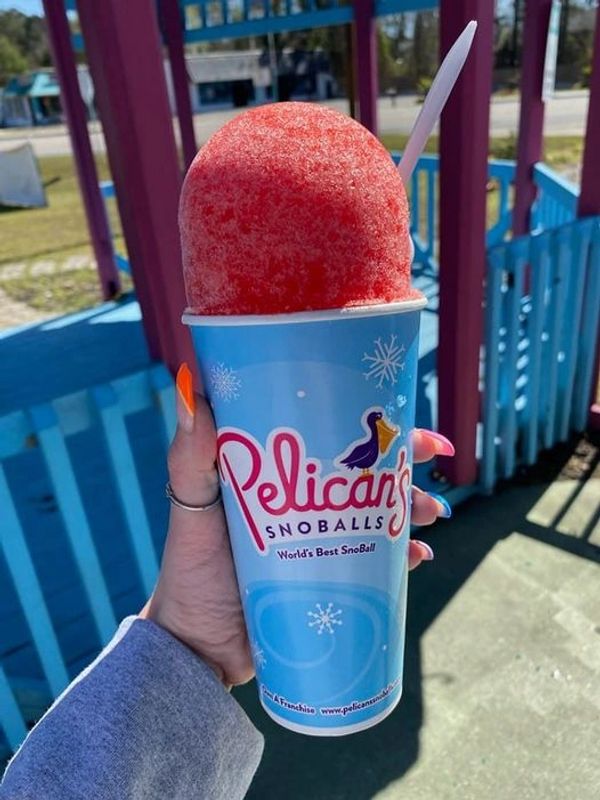 Red snoball in front of storefront