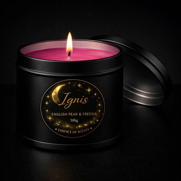 Lit pink candle in a black tin labeled Ignis with English Pear & Freesia scent.
