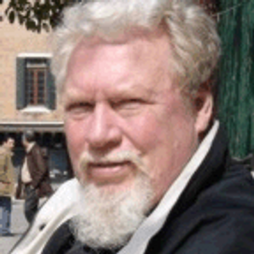 Jerry Fletcher, Networking Ninja taking time to relax beside a canal in Venice.