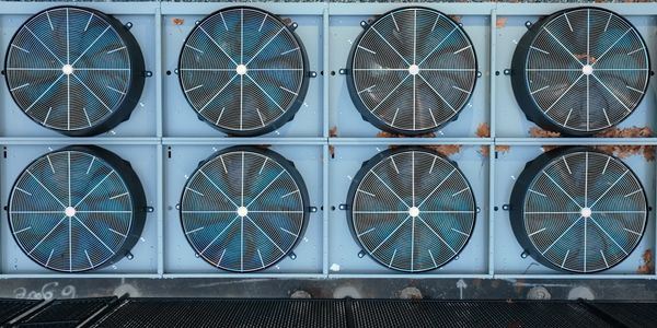 Eight large industrial ventilation fans.