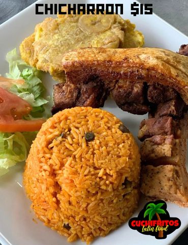 Deep fried pork skin with rice, tostones, and salad
