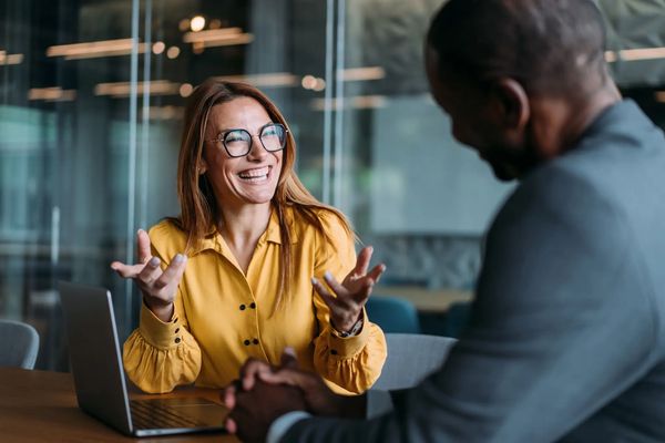 Two people discussing business strategy.