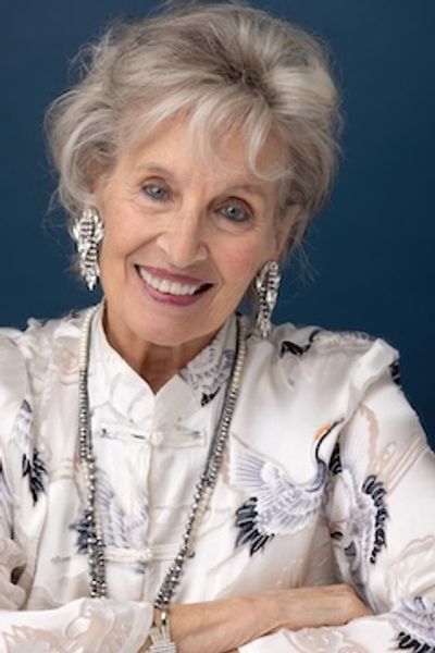 Andrea Marcovicci smiles